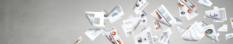 Businessman controlling paper documents flying in air